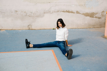 Woman sitting with open legs