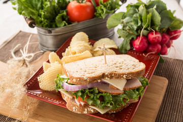 Ham Turkey Sandwich With Lettuce Tomatos Potato Chips