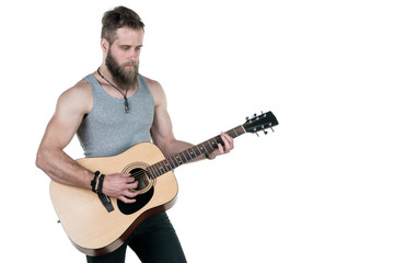 A charismatic man with a beard holds an acoustic guitar, on a white isolated background. Horizontal frame