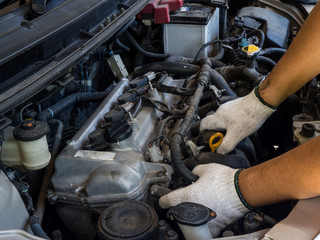 Car mechanic working in auto repair service