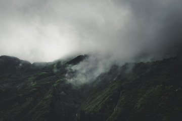Dense grey fog and cloud on a high mountain summit