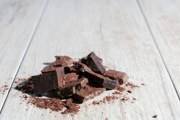 Pile of chocolate on wood texture