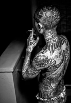 Black and White portrait of a heavily tattooed Japanese man