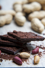 Pile of dark chocolate covered with cocoa powder