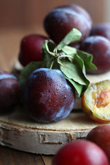 Plums on a wooden background