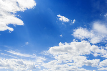 Blue sky background with tiny clouds