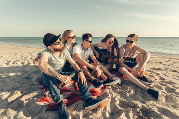 Fototapeta premium group of friends having fun on the beach