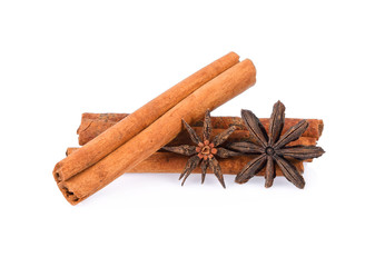 pile of dried cinnamon and star anise spice isolated on white background
