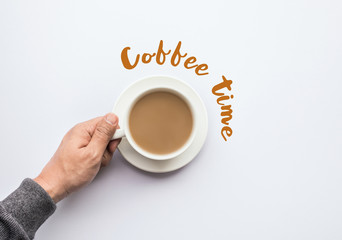 Coffee time text with male hand holding cup of coffee.business and drink concept