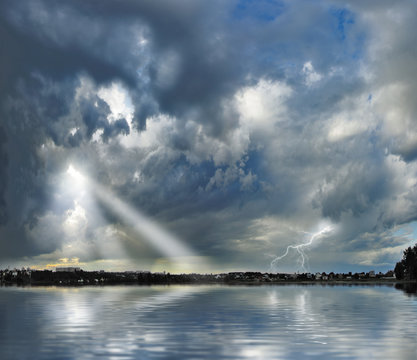 Image of a thunderstorm over the river