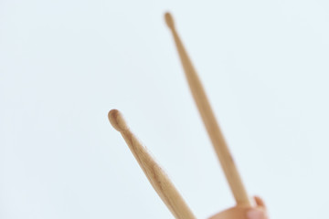 Drumsticks on white background, close-up