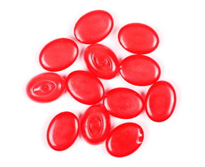 Red candies isolated on white background, top view