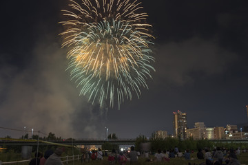Toyohira River Fireworks, this festival is regarded as Hokkaido most popular fireworks festival over 4000 fireworks light up the night sky over Sapporo, Japan. Image show noise due night shot.