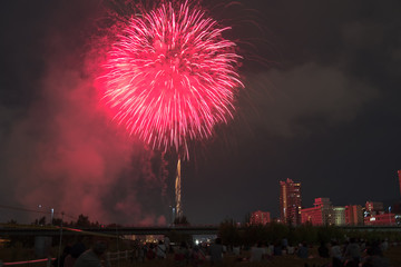 Toyohira River Fireworks, this festival is regarded as Hokkaido most popular fireworks festival over 4000 fireworks light up the night sky over Sapporo, Japan. Image show noise due night shot.