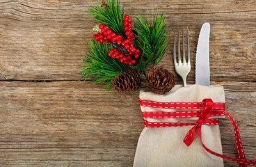 Christmas table setting on wooden background