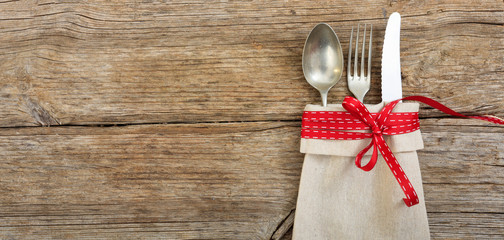 Christmas table setting on wooden background