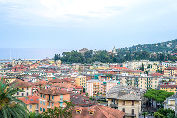 Beautiful evening sunset view from top to Santa Margherita Ligure city. Blue sky and colorful buildings. Italy beauties.