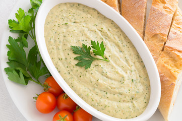 roasted eggplant dip with yogurt, onion, garlic, lemon juice, olive oil, and olive oil  added 