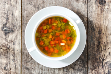 Vegetable soup in bowl on wooden table

