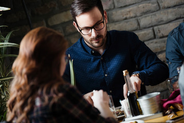Attractive man and cute woman having meal