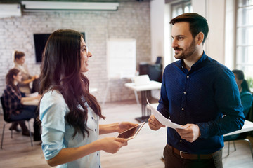 Picture of young designers discussing in office