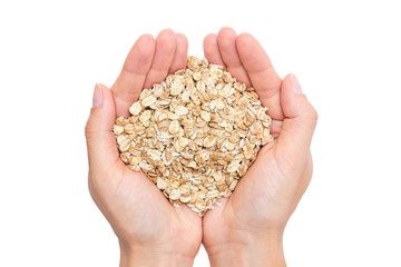 oat in woman's hand isolated on white background