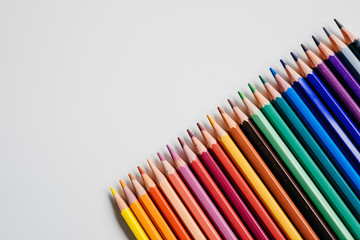 .Minimalist composition of wooden pencils of many different colors. Back to school photography - obrazy, fototapety, plakaty