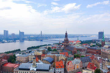 Fototapeta na wymiar Aerial view of the old town and Vansu bridge with Daugava river from the tower of St. Peter's church in Summer, Riga Latvia