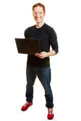 Webdesigner mit Laptop Computer im Internet