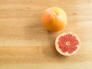 Top view - Juicy grapefruits on wooden background ( space and composition for text )
