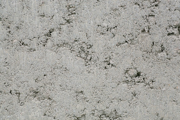 Grey concrete wall of a new building with apartments. Background texture