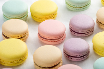 Fototapeta na wymiar Colorful macarons on a white background. French dessert