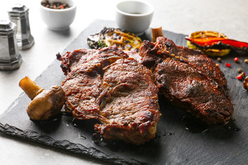 Tasty steaks on slate plate