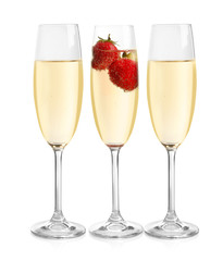 Glasses of delicious wine with strawberry on white background