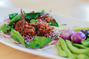 Deep fried spicy minced pork ball with vegetables
