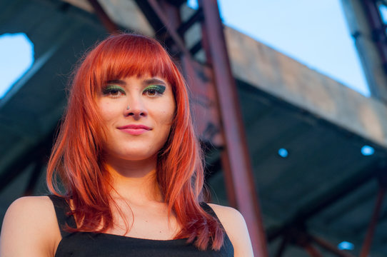 Red head sexy streaptease girl urban concrete destruct landscape
