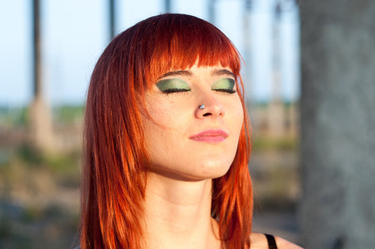 Red head sexy streaptease girl urban concrete destruct landscape