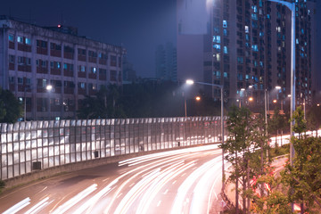 White and red lights on the road. night scene of modern city