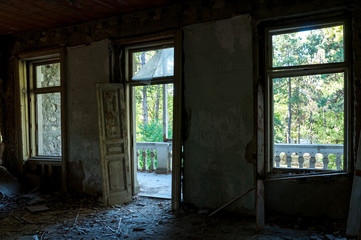 Fototapeta na wymiar Interior of abandoned house of rich people in the war zone with selective focus.