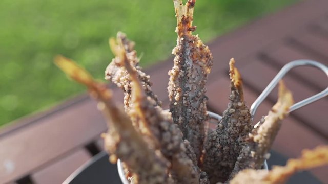 Fried capelin wiht sauce, crispy fried fish, cooking seafood, dishes with fish, beer snack