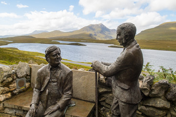 Statues of the geologists Benjamin Peach and John Horne at hiking trail at Knockan Crag in North West Highlands Geopark, Scotland