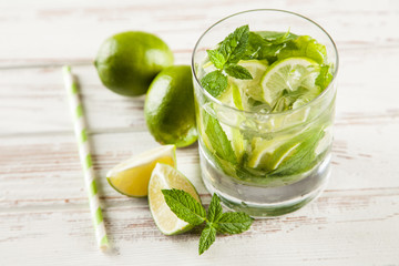 Mojito cocktail on white wood background
