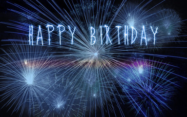 Happy birthday fireworks greeting with space for text. Light blue sparks.