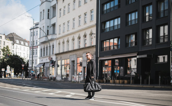 Man crossing one of the streets of Berlin