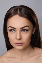 Obraz premium Eyelashes extensions. Fake Eyelashes. Closeup Of Beautiful Young Female Model With Soft Smooth Skin And Professional Facial Makeup. Portrait Of Sexy Girl With Long Fake Eyelashes And Perfect Make-up.