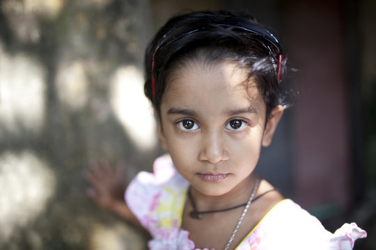 A beautiful kid looking at the camera