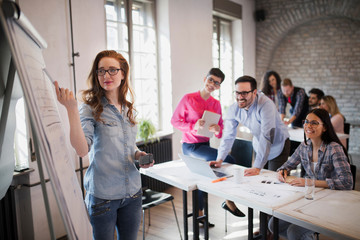 Picture of architect doing presentation to her colleagues