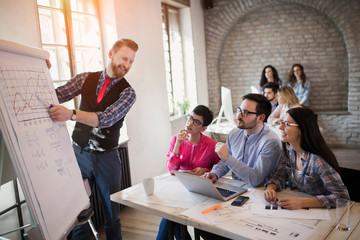 Picture of architect doing presentation to his colleagues