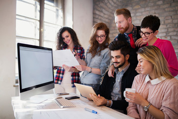 Group of young architects using digital tablet