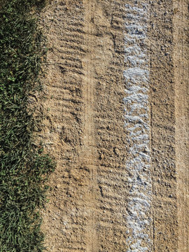 Close up of white boundary marks on baseball field